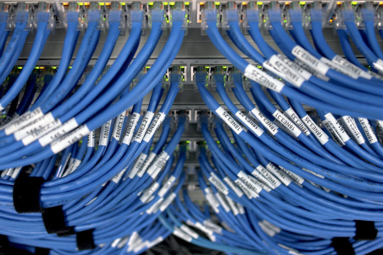 Network switch and ethernet cables in server rack