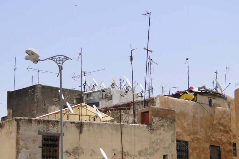 Rooftop TV aerials and satellite dishes on buildings